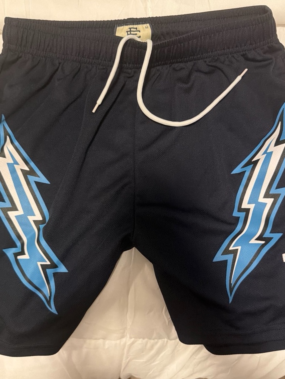 Eric Emanuel Black Athletic Shorts with Blue Lightning Motif